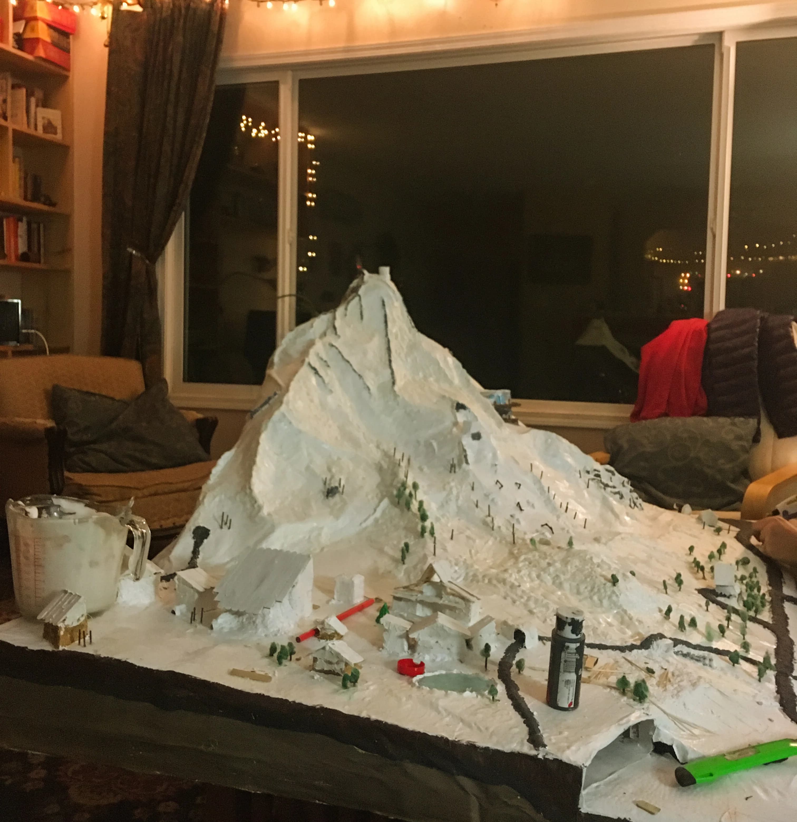 A detailed miniature model of Don't Know Ski Hill, a snowy mountain landscape with buildings and trees