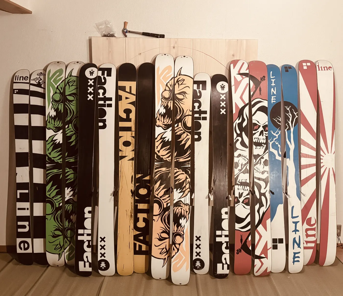 A collection of powder skis at Wakaranai Lodge, including fat twins gathered for deep Hokkaido snow