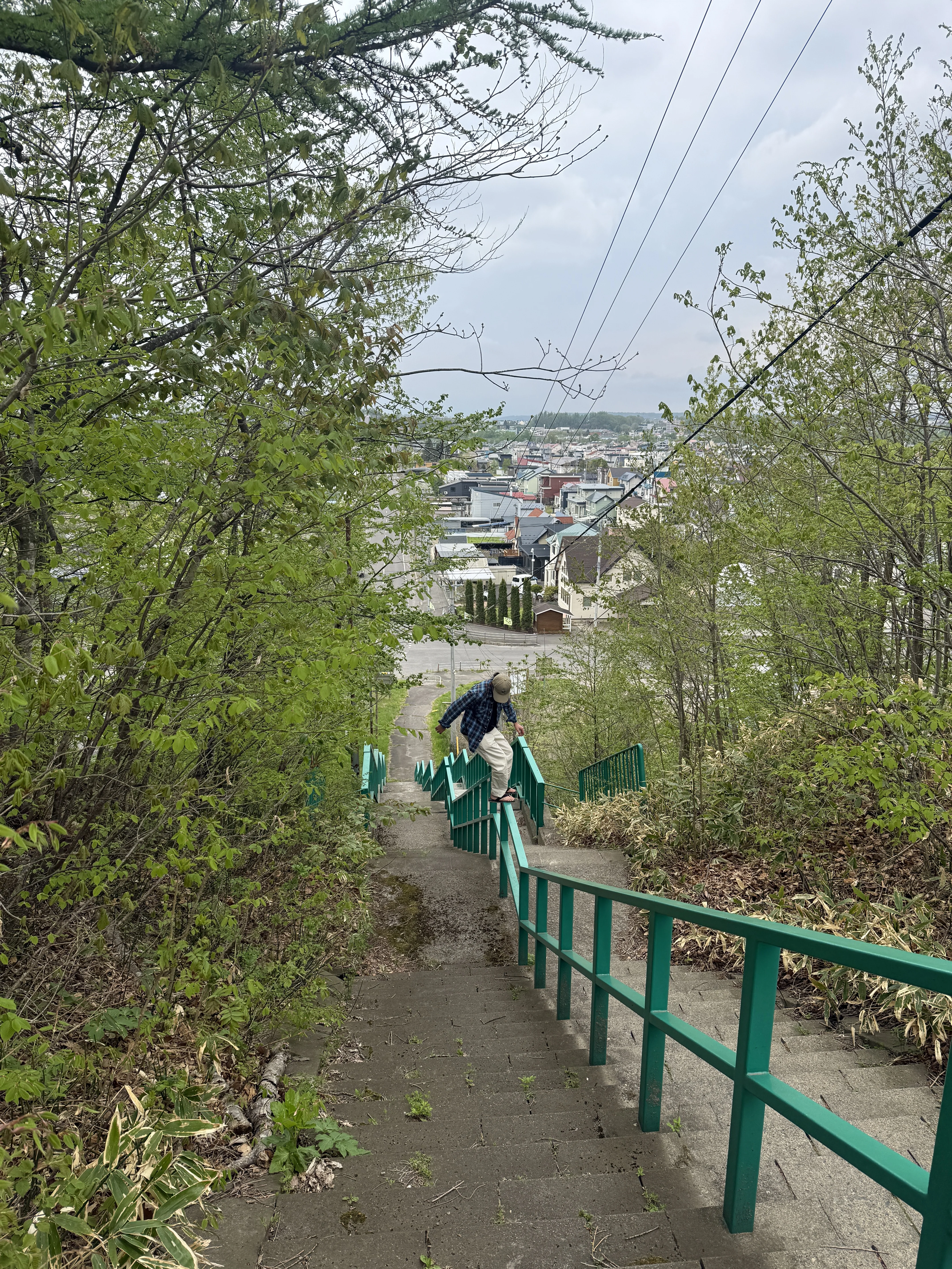 rainy stairway view down toward town in Obihiro